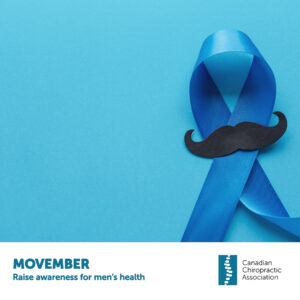 Blue ribbon on sky blue blackground with a black mustache instead of a pin, representing Novembers Movember awareness month for men's health.